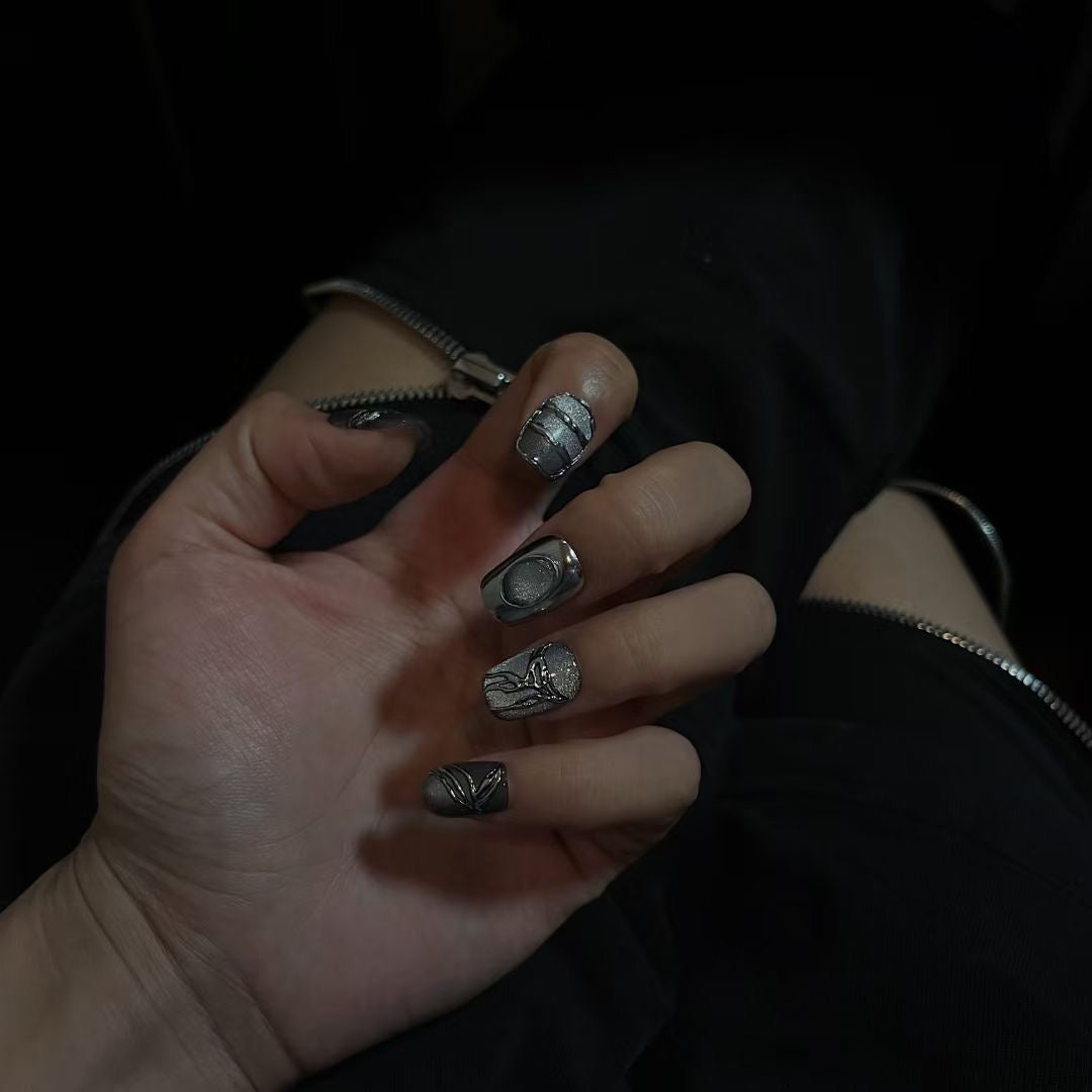 Real shot of the effect of Green and Silver Nails on the hands