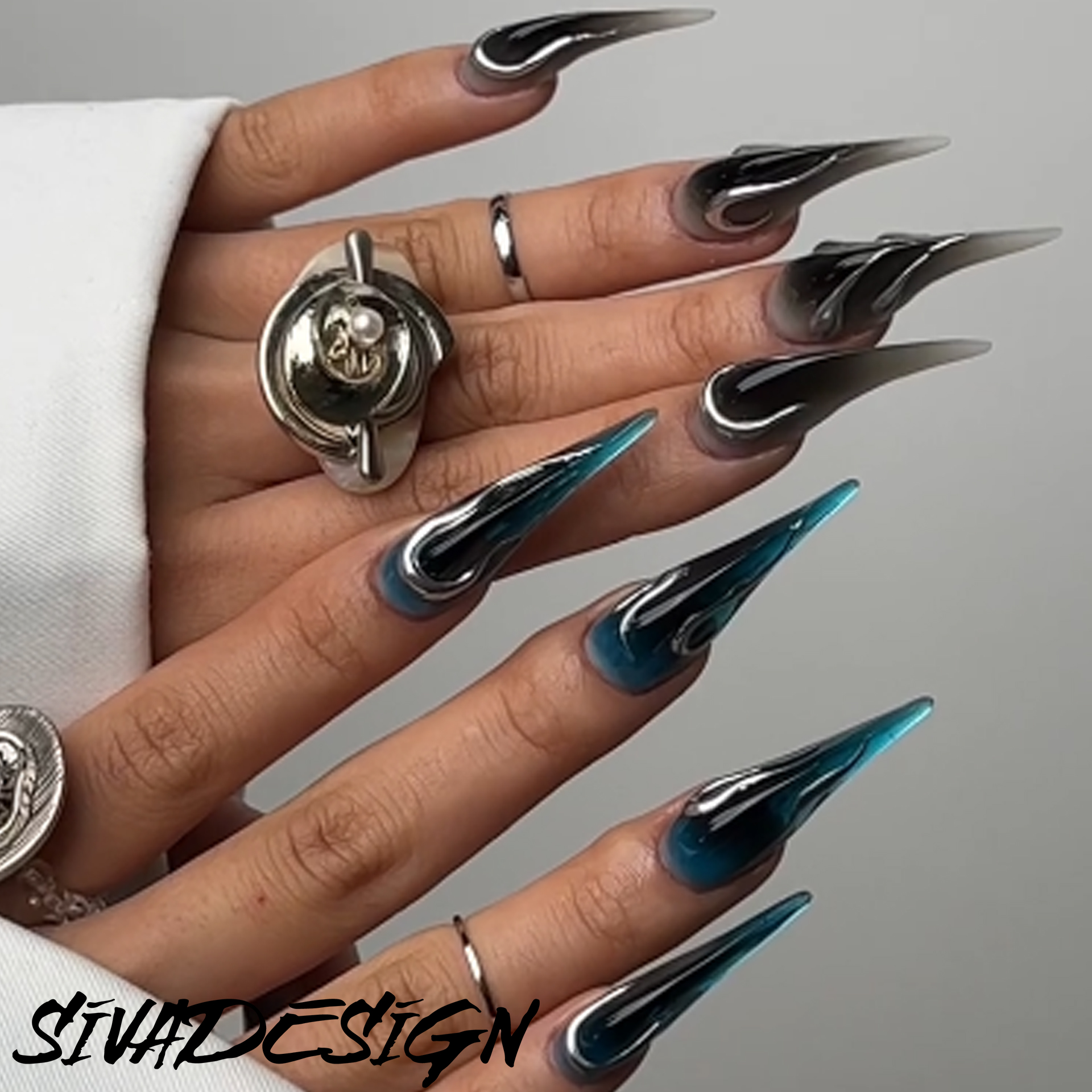 Sleek Chrome and Blue Stiletto Nail Art